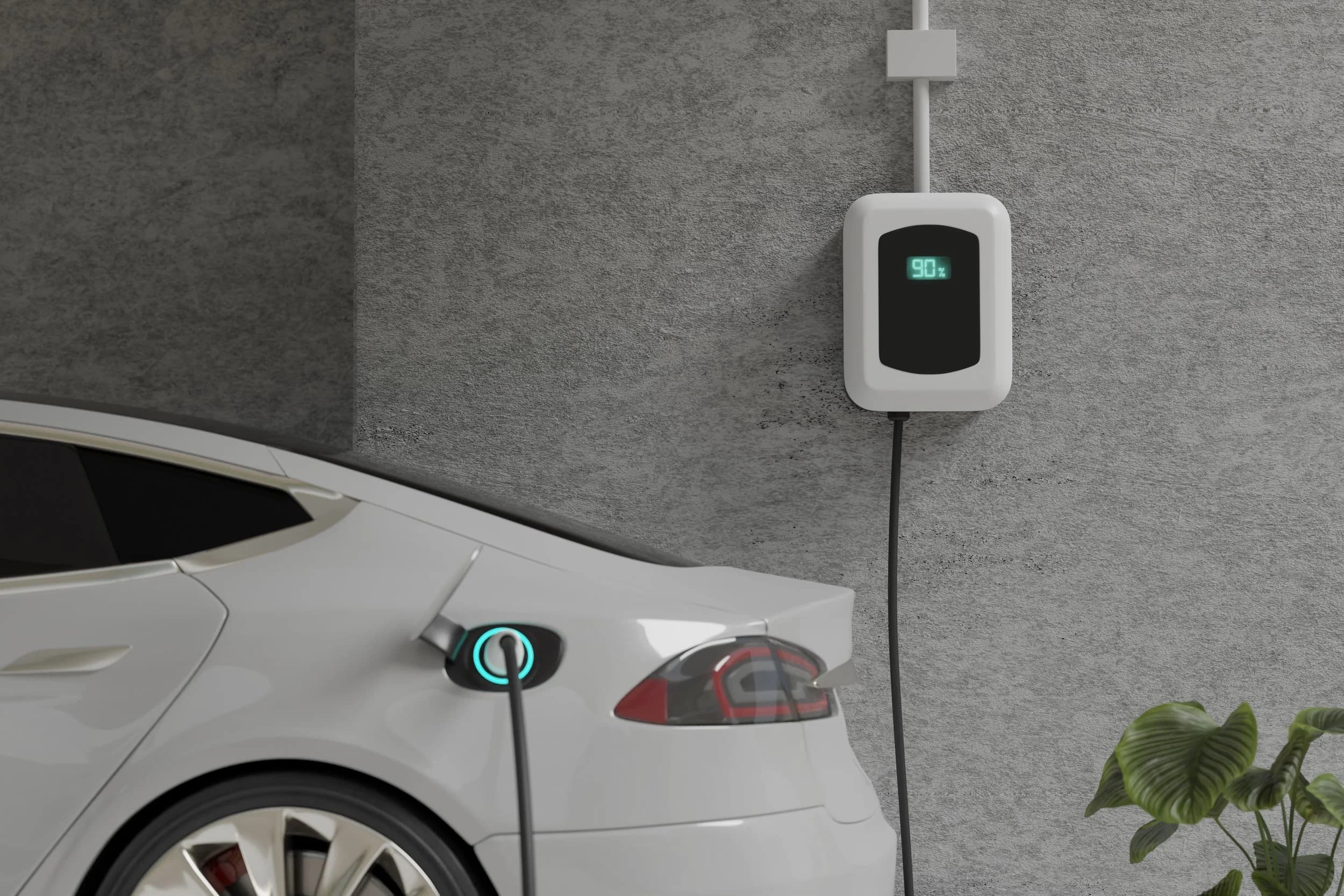 A home EV charger mounted on a wall charging an electric vehicle